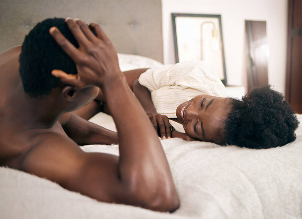 Shot of a young couple relaxing together at home. - Fotó, kép