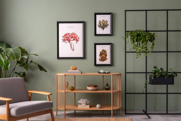 The stylish composition at living room interior with wooden console and elegant personal accessories. Mock up poster. Green wall. Plants in cozy apartment. Home decor. Template.  - Fotoğraf, Görsel