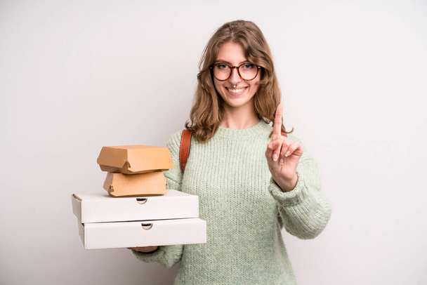 young girl with pizzas and burgers. take away fast food concept - Zdjęcie, obraz