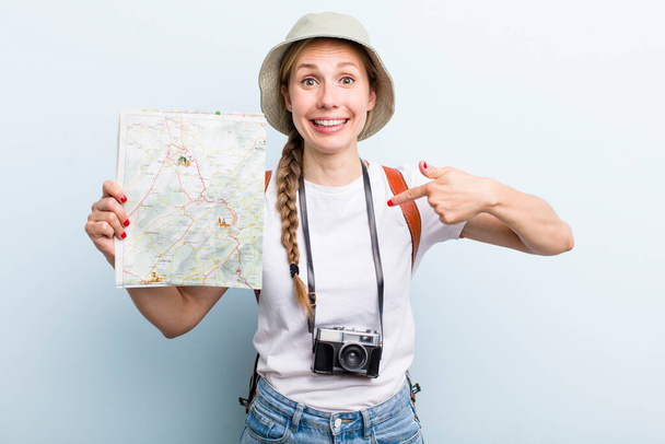 young adult blonde woman. tourist with a map concept - Φωτογραφία, εικόνα