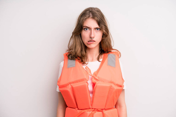 teenager girl. life jacket and boat concept - Fotó, kép