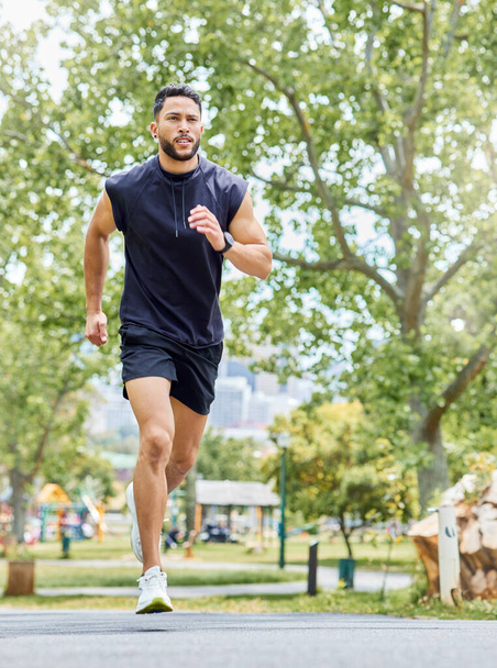 Shot of a sporty young man running outdoors. - Foto, Imagem