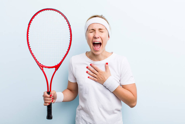 pretty blonde young adult woman. tennis sport concept - Фото, изображение