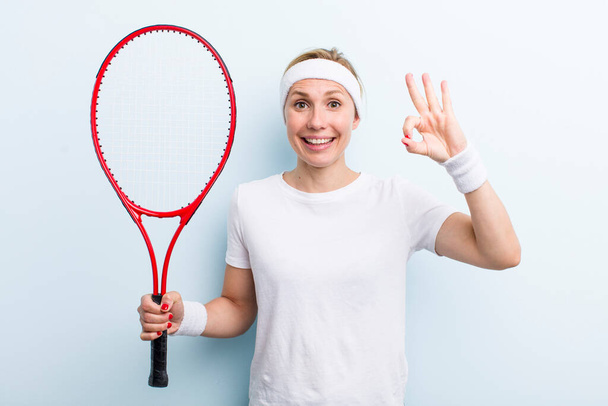 pretty blonde young adult woman. tennis sport concept - 写真・画像