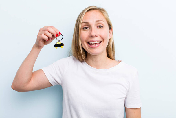 pretty blonde young adult woman with a car key - Foto, Imagen