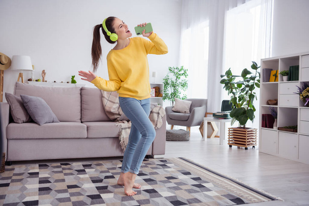Full length body size view of attractive cheerful funny dreamy girl dancing having fun good mood at home house flat indoors. - Photo, Image
