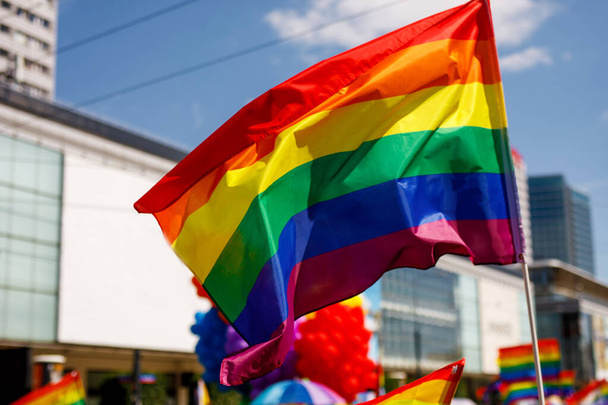 Lgbt pride rainbow flag during parade in the city - Фото, изображение