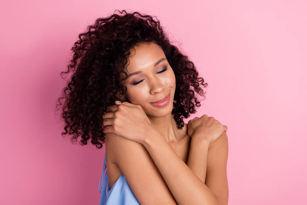 Portrait of adorable gorgeous lady closed eyes hands embrace shoulders isolated on pink color background. - Foto, Imagem
