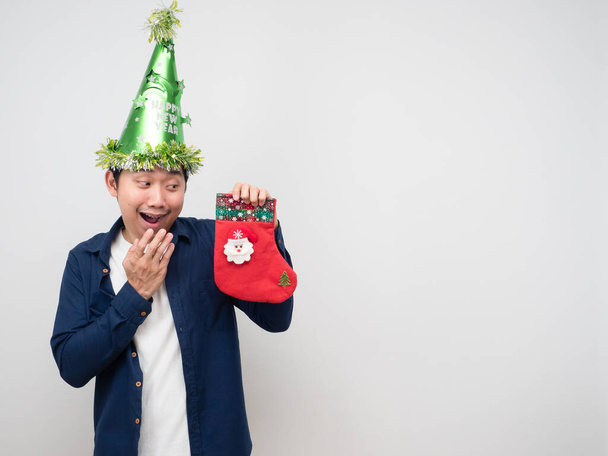 Man feeling happy with christmas stocking in his hand - Foto, Imagen