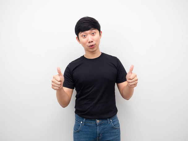 Asian man black shirt thumb up portrait - Photo, image