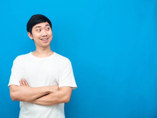 Man white shirt cross arm happy smile looking at copy space blue background - Photo, Image