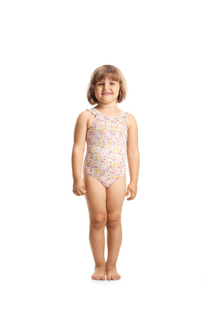 Girl in a swimming suit smiling at camera isolated on white background - Fotó, kép