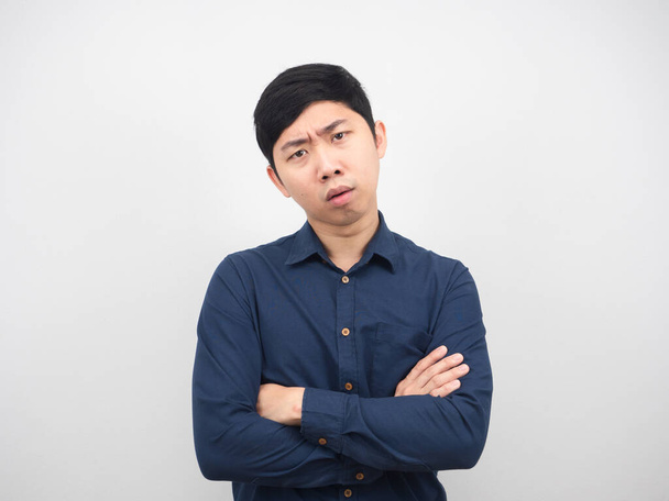 Man cross arm feeling confused serious face white background - 写真・画像
