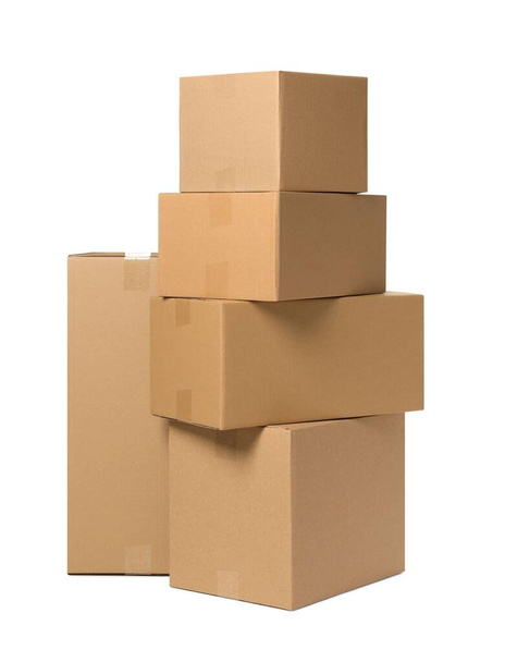 Many closed cardboard boxes on white background. Delivery service - Zdjęcie, obraz