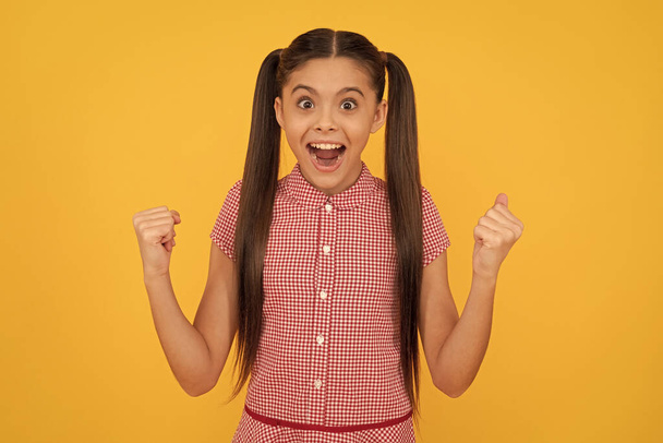 I can and I win. Happy girl scream making winning gesture. Excited child got win. Kid winner celebrate victory. Success and achievement. - Zdjęcie, obraz