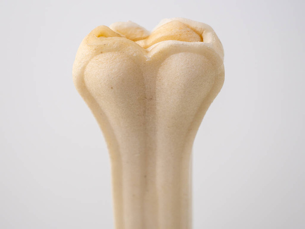 Pressed rawhide bone shaped dog chews isolated on a white background - Photo, Image