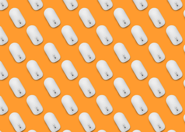Many white computer mouses on orange background, flat lay. Seamless pattern design - Photo, Image