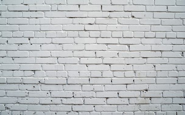 Texture of old brick wall painted with white paint - Foto, Bild