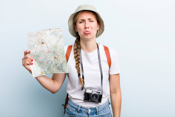 young adult blonde woman tourist with a map. holidays concept - Photo, Image