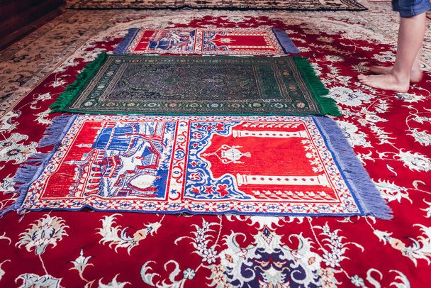 Kruszyniany, Poland - August 25, 2018: Prayer carpets in old mosque of Lipka Tatars community in Kruszyniany village - Фото, зображення