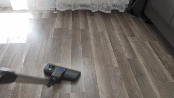 Vacuuming the floor. House cleaning. High quality 4k footage - Felvétel, videó