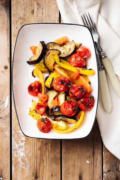Salad with roasted tomatoes, eggplants, zucchini, bell peppers. - Фото, изображение
