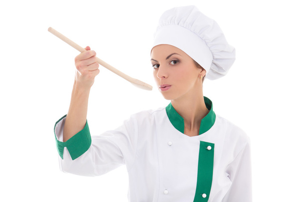 portrait of young woman in chef uniform tasting something isolat - 写真・画像