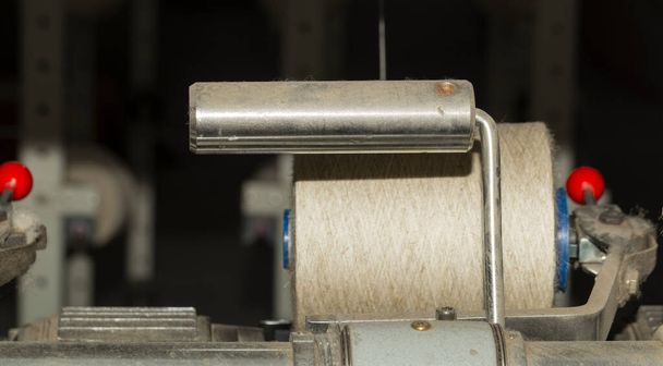 An old textile manufactory. Textile manufacturing. The work of textile processing machines. - Fotó, kép