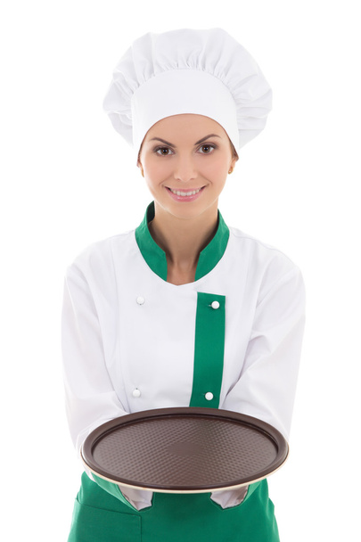 mujer joven chef en uniforme mostrando la placa vacía aislada en Pentecostés - Foto, Imagen