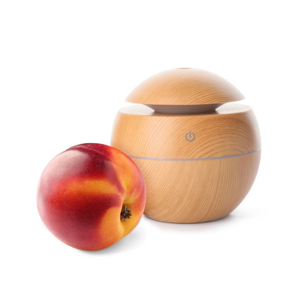 Aroma oil diffuser and peach on white background - Foto, imagen