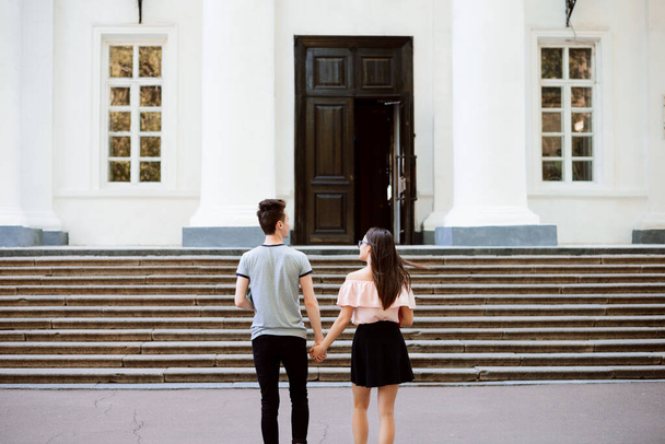 Two cheerful students in love heading to the university in the morning - Photo, Image