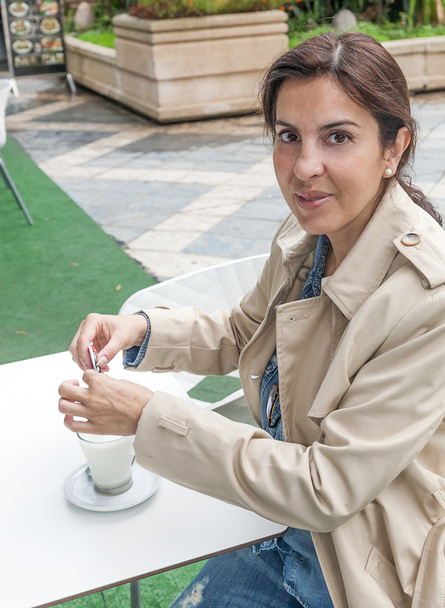 Brunette woman drinking a cofee - Photo, Image