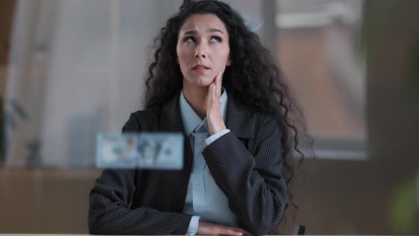 Portrait of curly haired shocked woman embarrassed girl female puzzled businesswoman being uncertain cover mouth with hand feel confusion about unexpected falling dollars money banknotes cash donation - Materiał filmowy, wideo