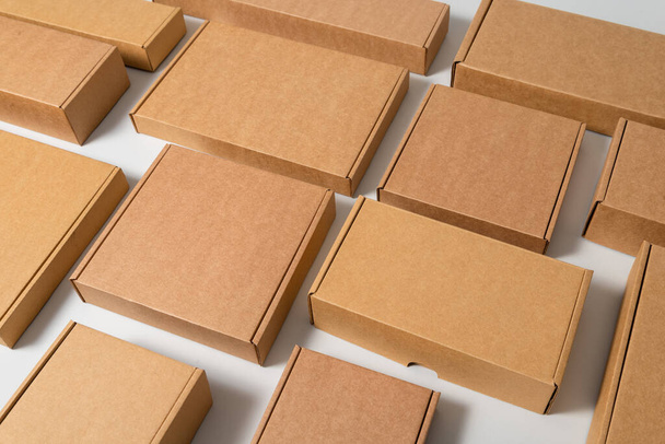 Lots of various cardboard carton boxes on white background - Fotó, kép