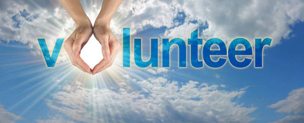 Bring light into life and become a Volunteer - blue sky banner with hands making the O of VOLUNTEER and a bright sun burst coming through the hands with copy space beneath - Photo, Image