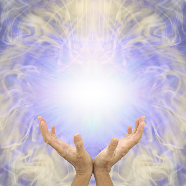 Sensing scalar healing energy message banner - female cupped hands reaching up to a  white light energy orb against a lilac and gold symmetrical ethereal  pattern background with copy space for messages  - Photo, Image