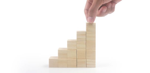 Business connecting piece of multi wood chart blocks steps in a hand - Fotó, kép