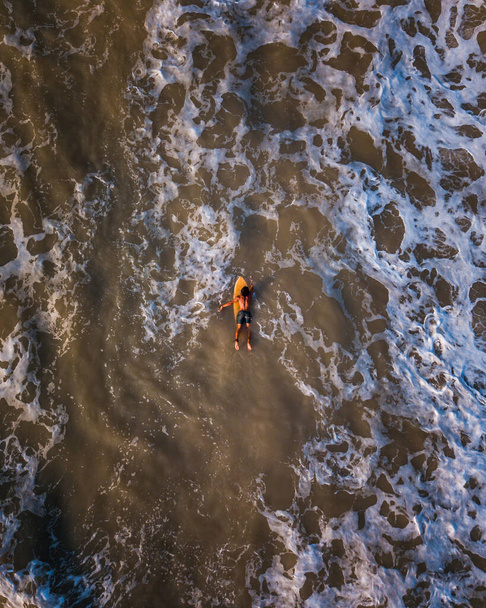 Aerial view of a surfer on his board in Palomino beach, Colombia. - Foto, immagini