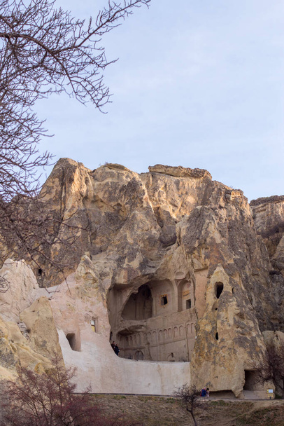 GOREME, TURKEY - December 11, 2021: people in Goreme, in Cappadocia. The Goreme Open Air Museum has been a member of UNESCO World Heritage List since 1984 - Photo, image