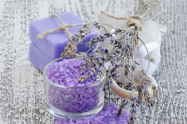 Bath salt for aromatherapy and dried lavender on an old wood table - Photo, Image