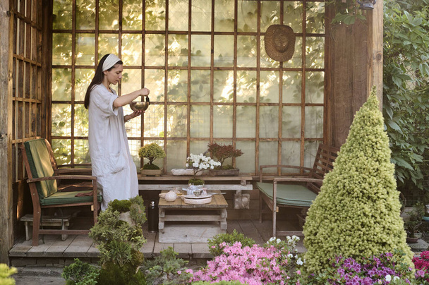 Traditional tea ceremony outdoor in a garden gazebo - Foto, afbeelding