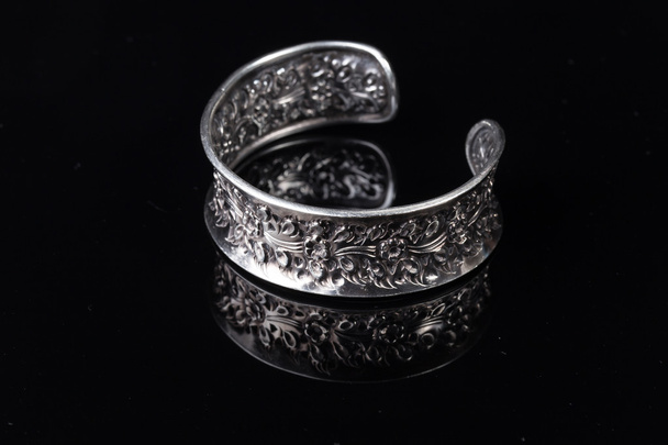 Old handmade Silver bracelet on black background - Photo, Image