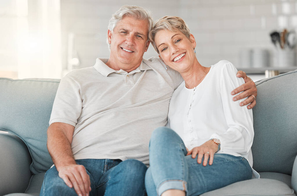 Shot of a happy senior couple relaxing on the sofa at home. - Foto, Imagem