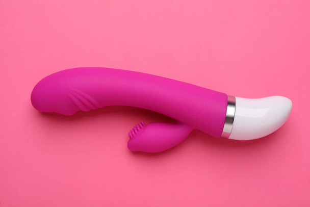 Vaginal vibrator on pink background, top view. Sex toy - Фото, зображення