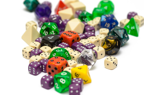 Multiple colorful role playing dices lying on isolated background - Photo, Image