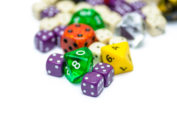 Multiple colorful role playing dices lying on isolated background - Photo, Image