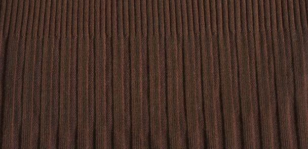 Pale brown knitting wool texture full frame. Knitted brown texture surface close up. - 写真・画像