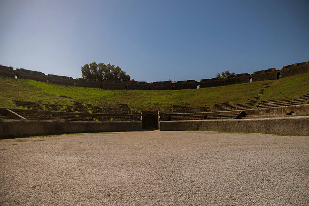 Archaeological park of Pompeii. Ancient city. The ruins of a Roman amphitheater for 20,000 people, where gladiatorial fights took place. Walks in the historical places of Europe - 写真・画像