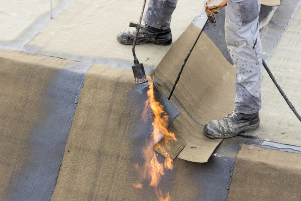 Insulation worker with propane blowtorch 2 - Photo, Image