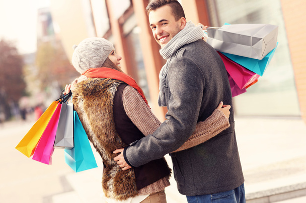 Beautiful couple shopping together - 写真・画像